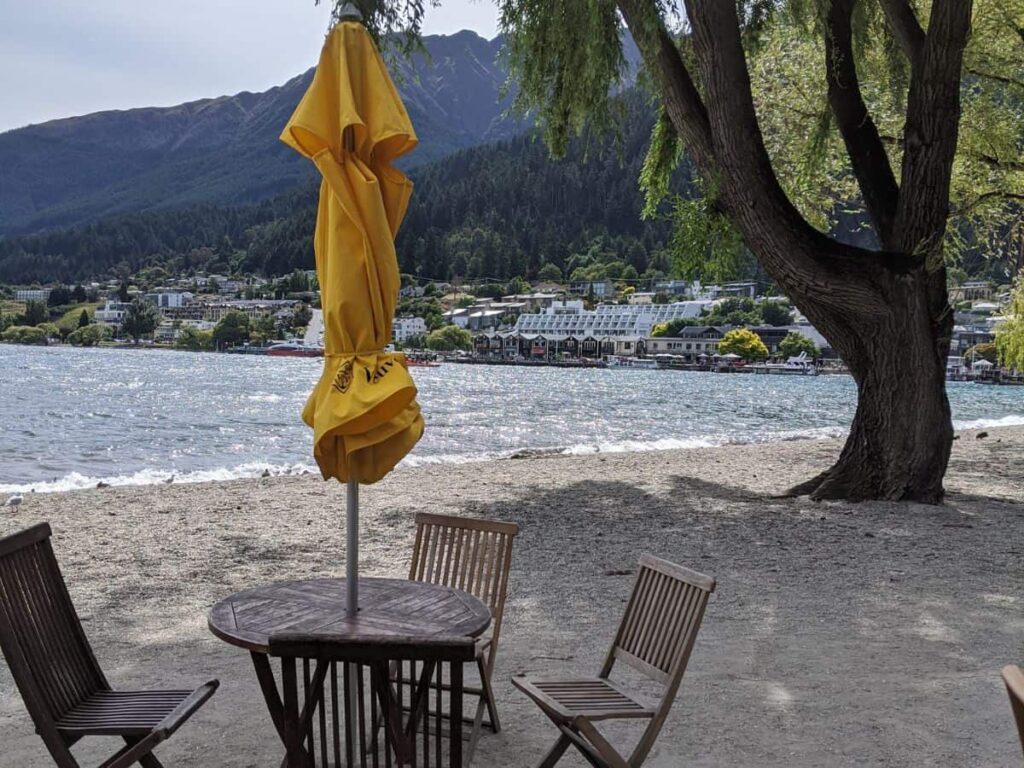 An outdoor table at The Boathouse on the beach of Lake Wakatipu