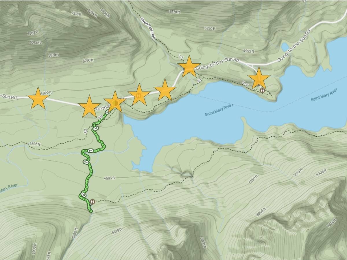 Topographic map section of Glacier National Park highlighting viewpoints along "Going-to-the-Sun Rd" with star icons beside Saint Mary Lake. A green hiking route appears south of the road while the map labels "Saint Mary River" and shows surrounding elevation lines and mountain terrain as part of a Glacier National Park itinerary.
