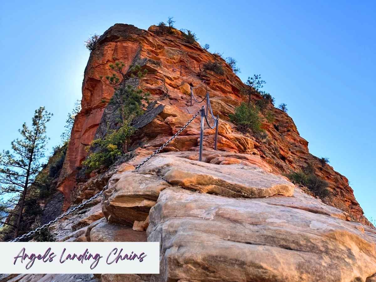 Steep red rock ridge with metal chains bolted into the stone for hikers to grip along the Angels Landing trail. Text on the image reads Angels Landing Chains, highlighting one of the most thrilling and iconic sections to include in a Zion National Park itinerary.