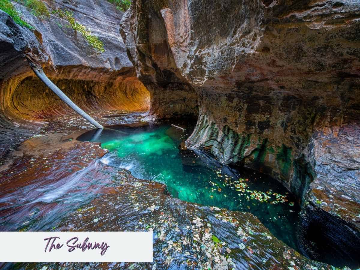 Vivid turquoise pool carved into smooth red rock at The Subway in Zion National Park, with water flowing through the curved slot canyon walls. Text on the image reads The Subway, showcasing this stunning and permit only hike often featured in a Zion National Park itinerary for adventurous travelers.
